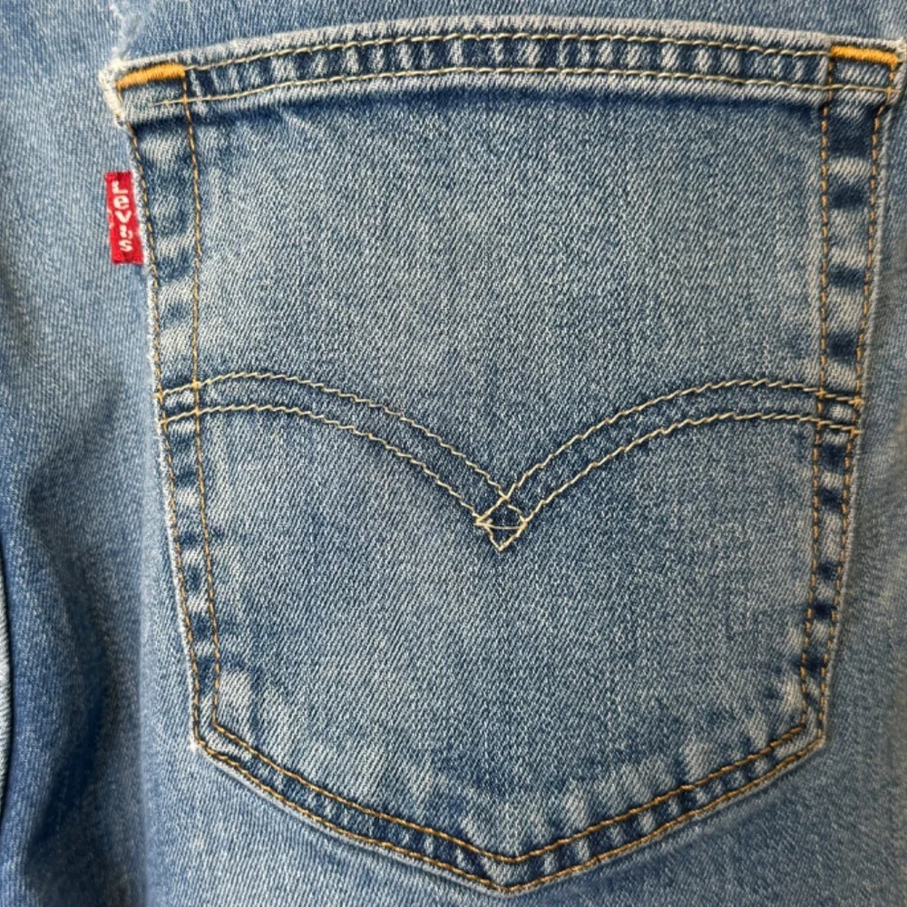 Levi’s 511 Perfect Medium Wash Thrashed Distressed High Rise Slim Tapered Jeans